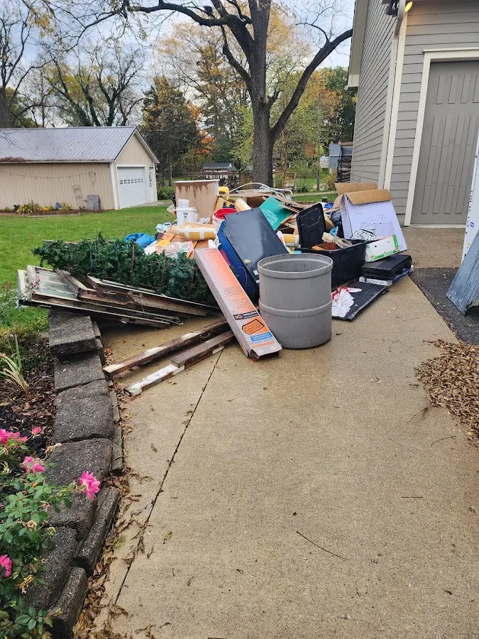 Dumpster being loaded with debris for 10 Yard Dumpster Rental in Travis Ranch